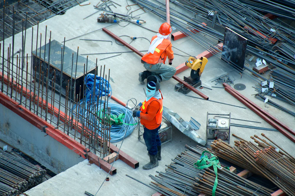 Construction crew working with reinforcement steel on an active site